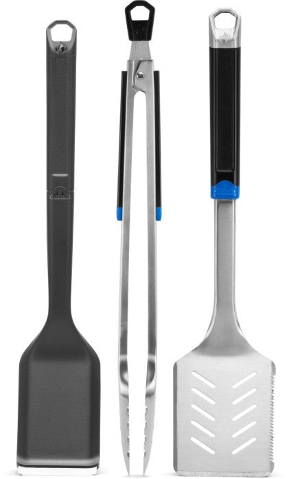 stainless steel grilling tool set including spatula, tongs, and brush from Napoleon Essential Series.